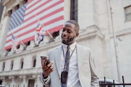 Cheerful person excited by what he sees on his cell phone