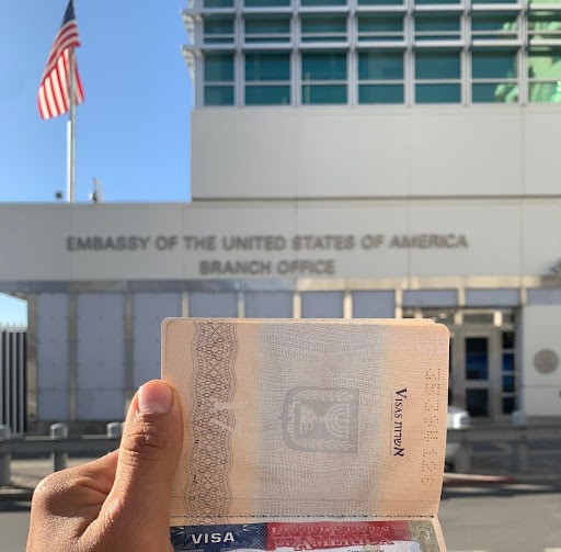 Picture of the US visa against the background of US Embassy in Israel
